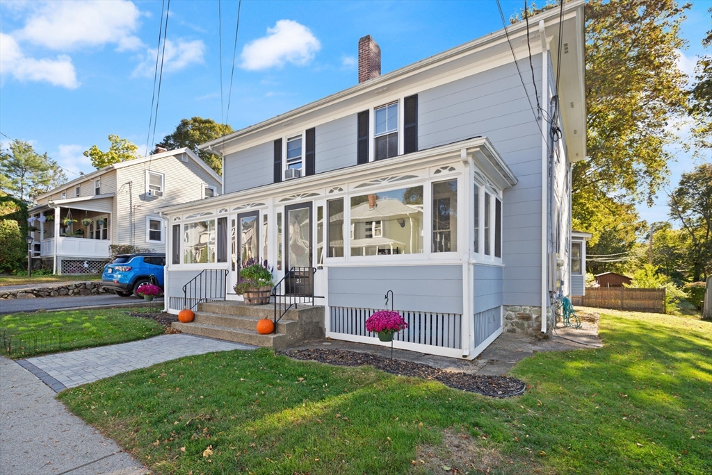 35 Roosevelt Street, Unit 35 Maynard, MA 01754 - Photo 2 of 39 a backyard of a house with barbeque oven outdoor seating and outdoor kitchen view