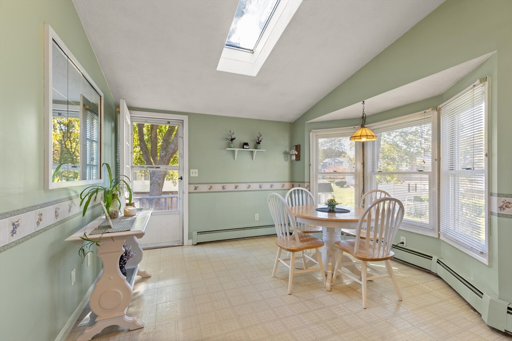 35 Roosevelt Street, Unit 35 Maynard, MA 01754 - Photo 21 of 39 a dining room with furniture and windows