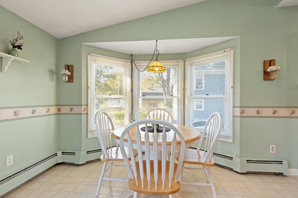 35 Roosevelt Street, Unit 35 Maynard, MA 01754 - Photo 23 of 39 a view of a dining room with furniture window and outside view