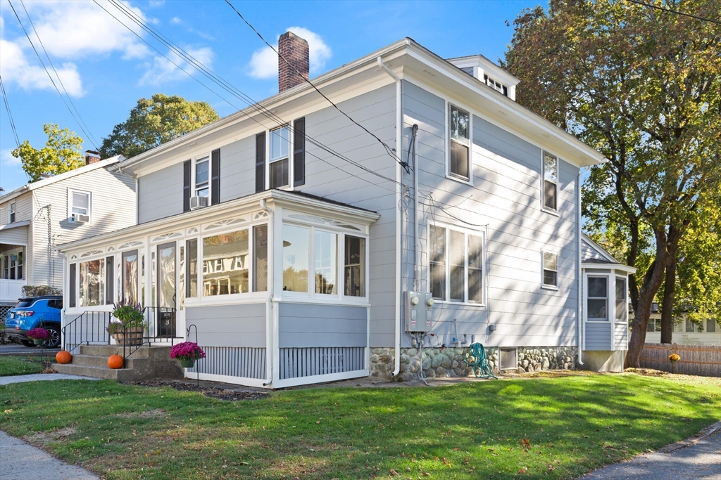 35 Roosevelt Street, Unit 35 Maynard, MA 01754 - Photo 3 of 39 a front view of house with yard