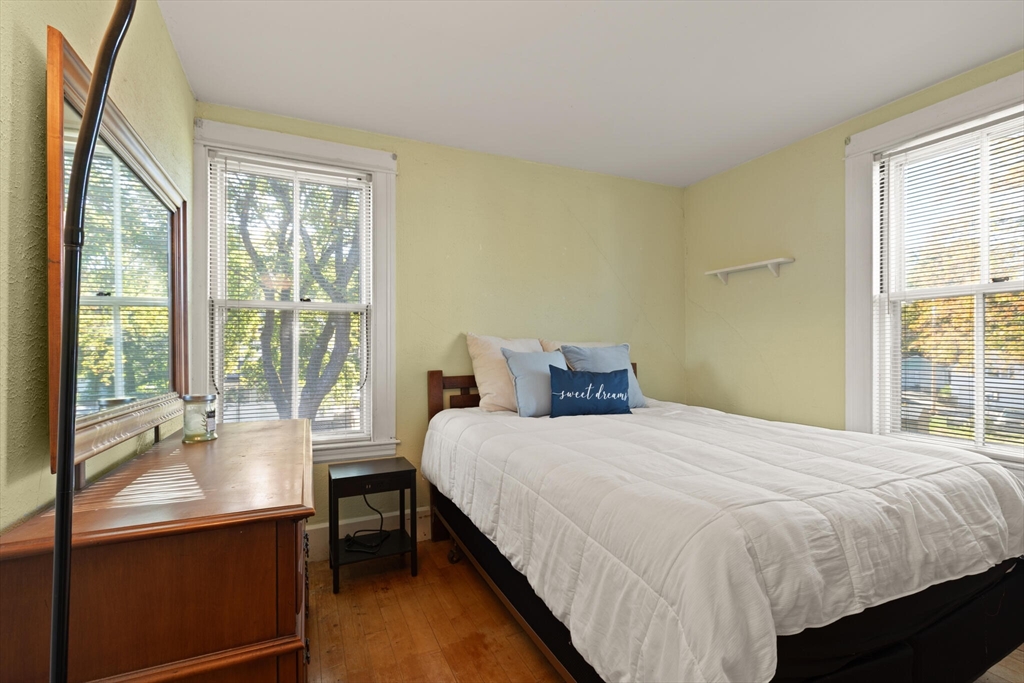 35 Roosevelt Street, Unit 35 Maynard, MA 01754 - Photo 31 of 39 a bedroom with a bed and a large window