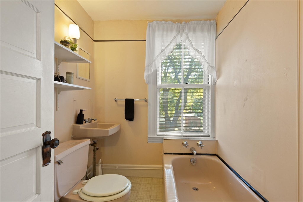 35 Roosevelt Street, Unit 35 Maynard, MA 01754 - Photo 32 of 39 a bathroom with a sink and a window