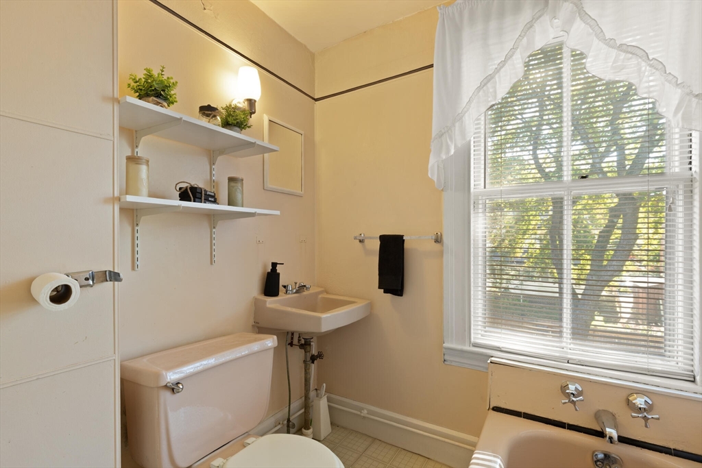35 Roosevelt Street, Unit 35 Maynard, MA 01754 - Photo 33 of 39 a bathroom with a sink and a window