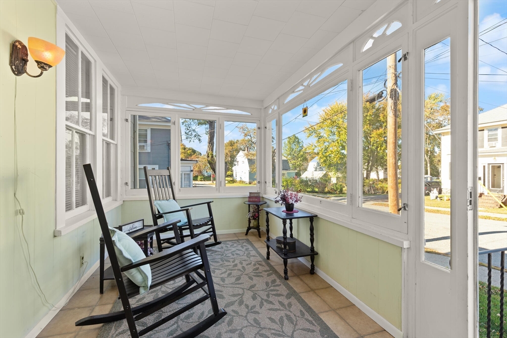 35 Roosevelt Street, Unit 35 Maynard, MA 01754 - Photo 7 of 39 a living room with furniture and a large window
