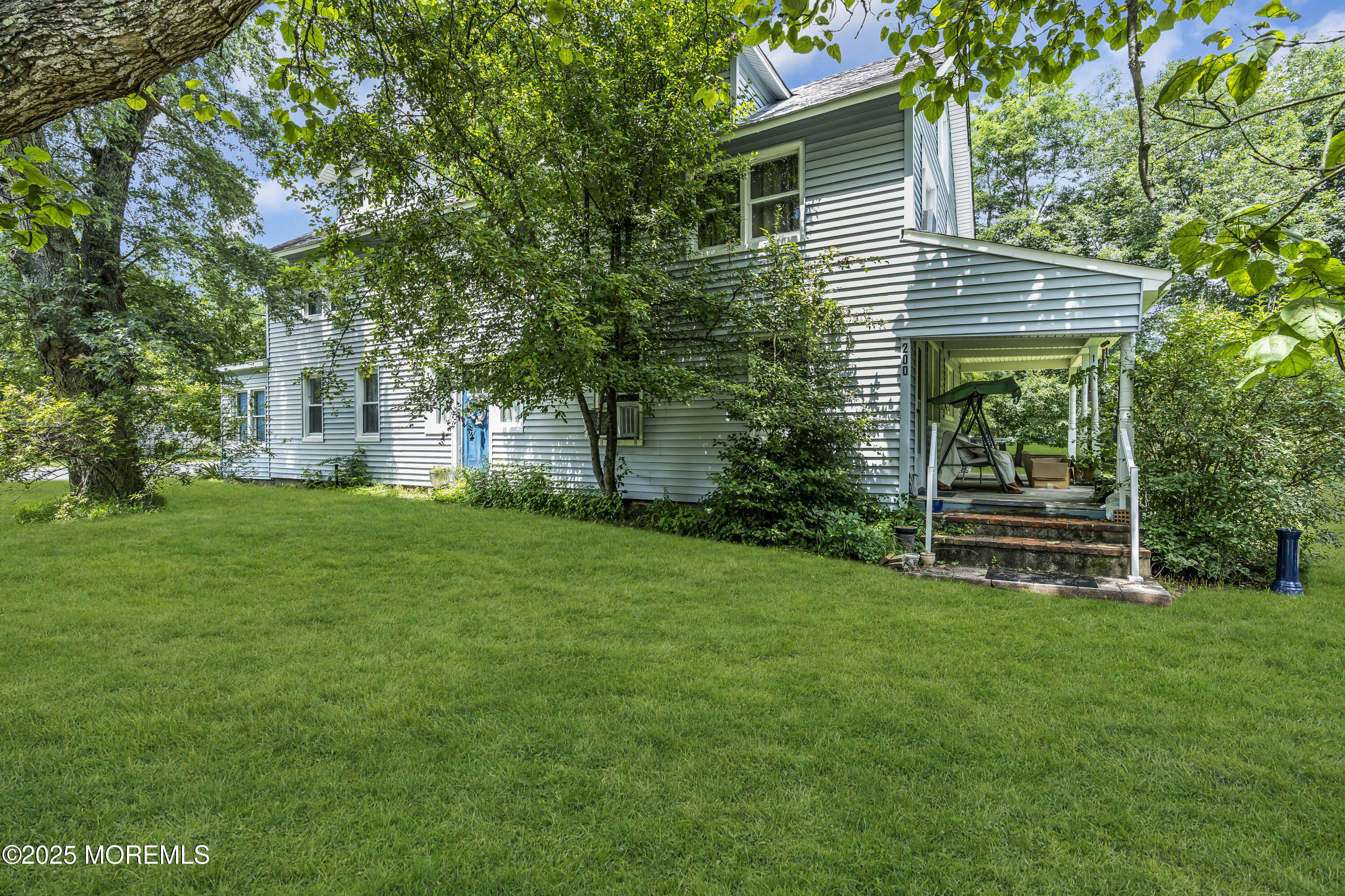 200 Cranberry Road Farmingdale, NJ 07727 - Photo 20 of 72 a front view of a house with a garden