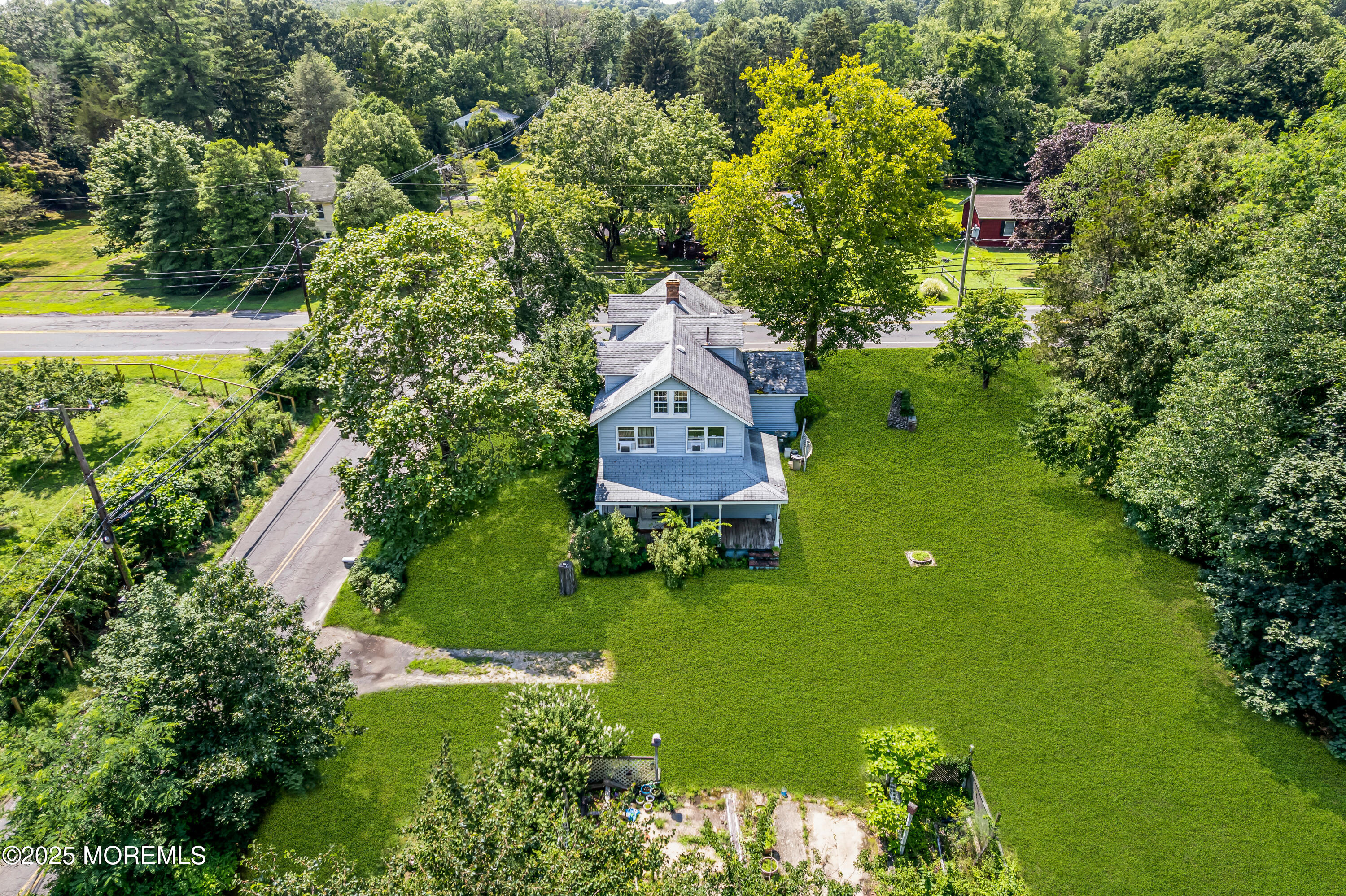 200 Cranberry Road Farmingdale, NJ 07727 - Photo 2 of 72 an aerial view of a house with a yard