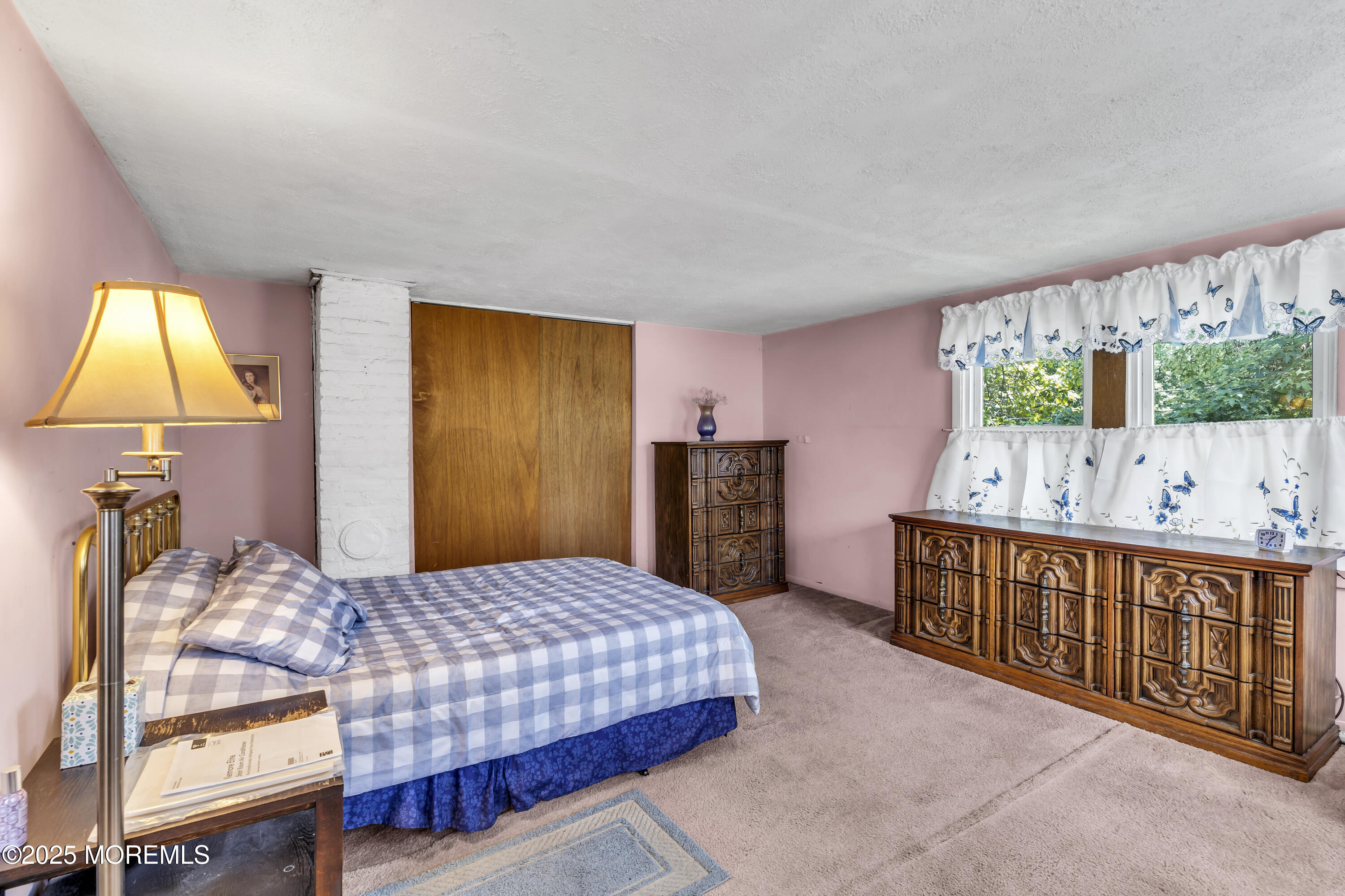 200 Cranberry Road Farmingdale, NJ 07727 - Photo 35 of 72 a bedroom with a bed and a dresser