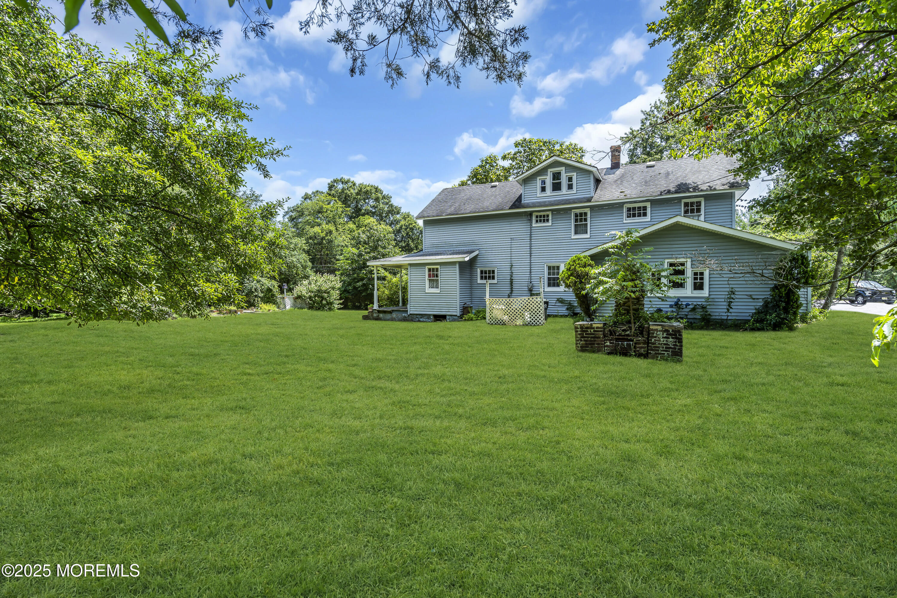 200 Cranberry Road Farmingdale, NJ 07727 - Photo 45 of 72 a front view of house with garden and trees