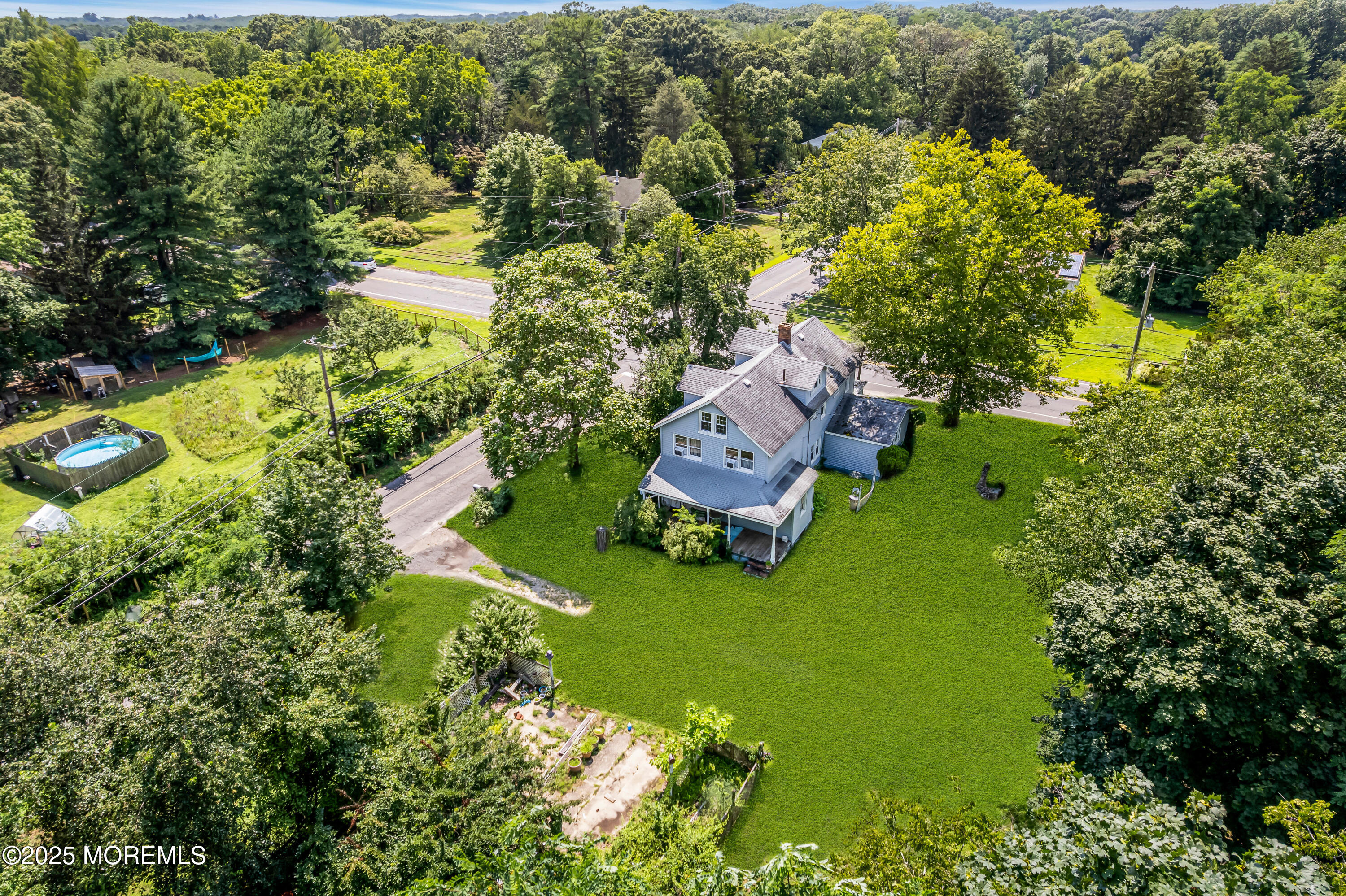 200 Cranberry Road Farmingdale, NJ 07727 - Photo 5 of 72 an aerial view of a house with swimming pool a yard and large trees