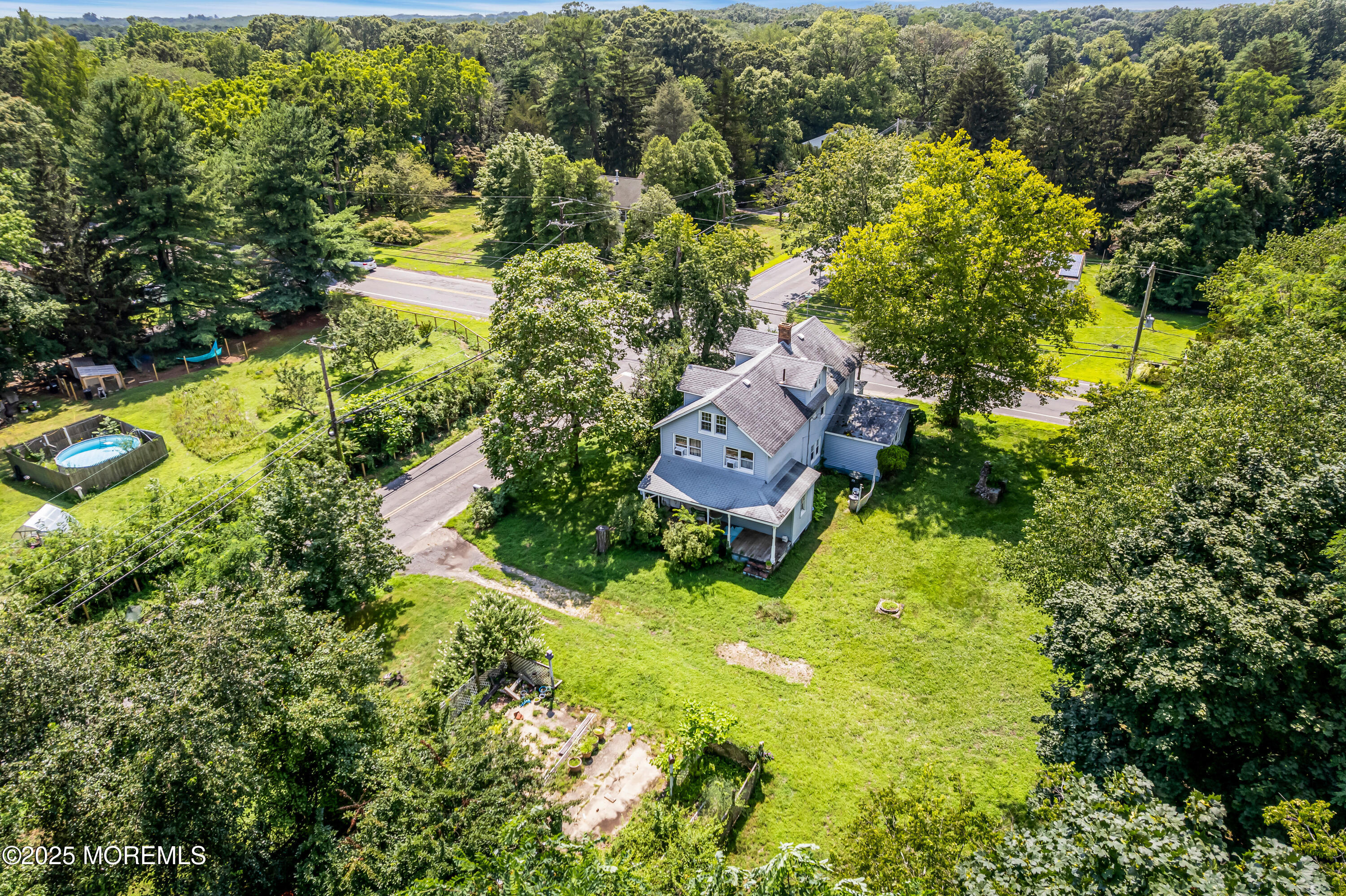200 Cranberry Road Farmingdale, NJ 07727 - Photo 53 of 72 an aerial view of a house with swimming pool and garden