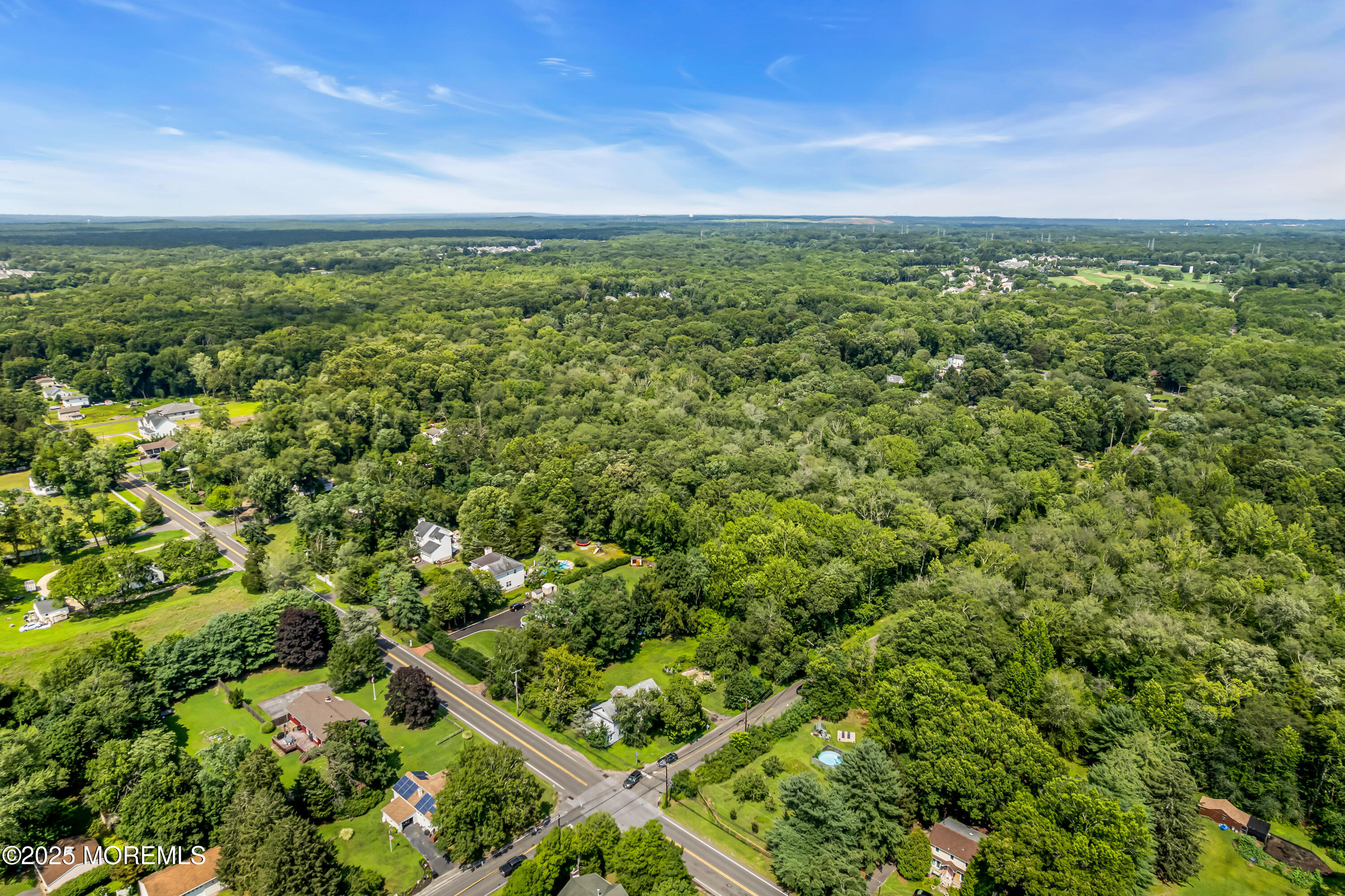 200 Cranberry Road Farmingdale, NJ 07727 - Photo 60 of 72 a view of a green field with lots of bushes
