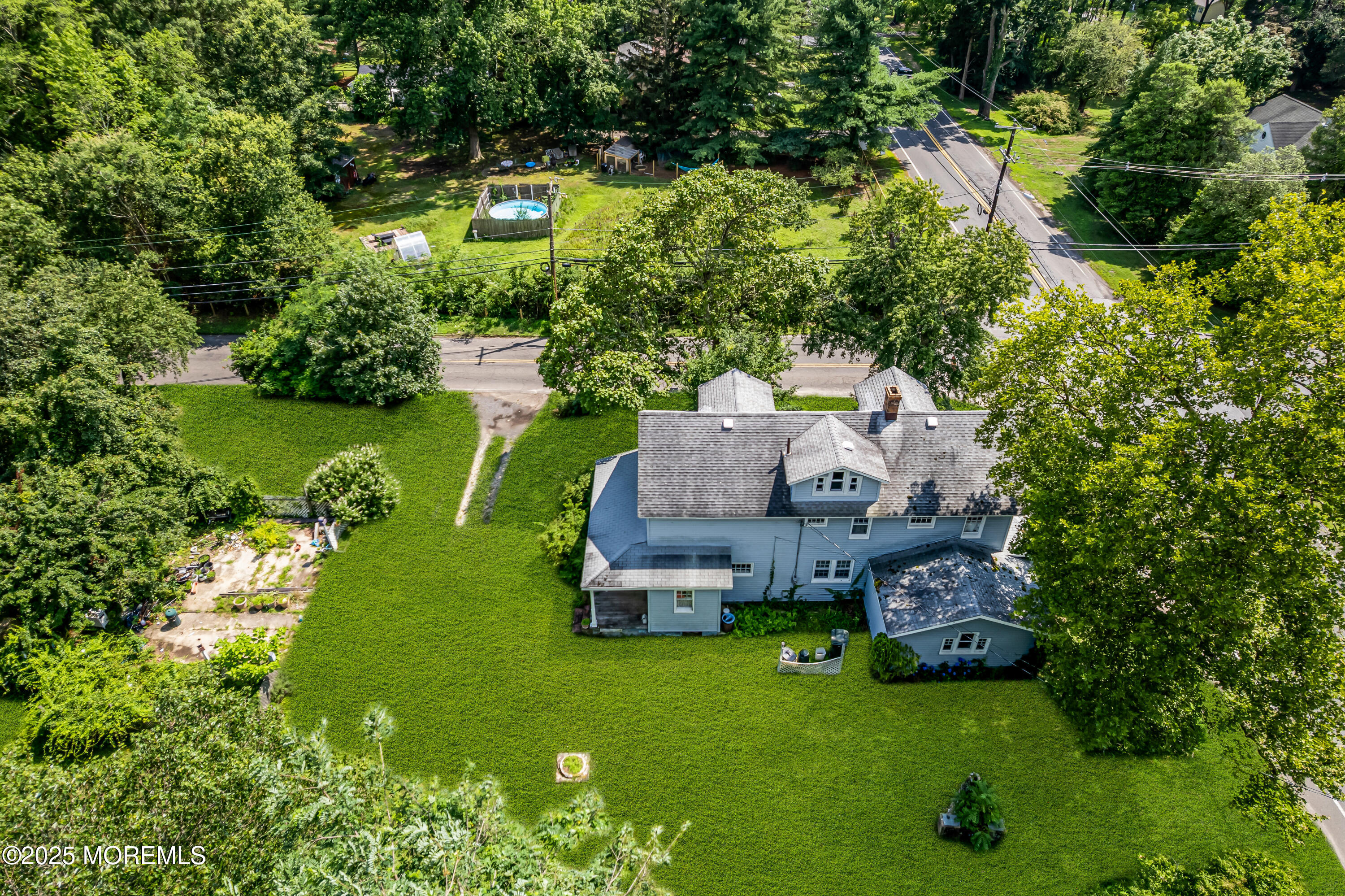 200 Cranberry Road Farmingdale, NJ 07727 - Photo 6 of 72 an aerial view of a house with swimming pool a yard and lake view