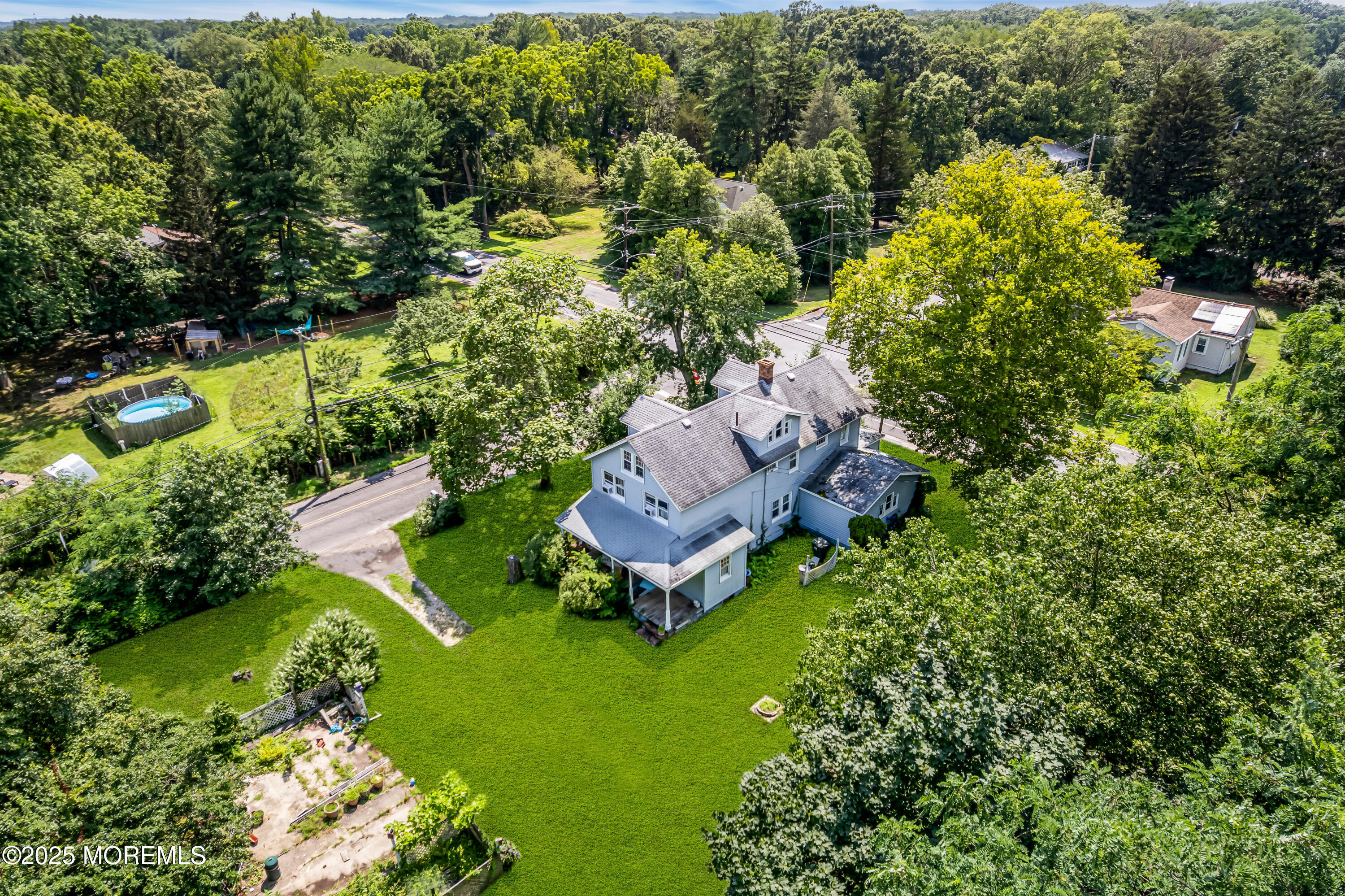 200 Cranberry Road Farmingdale, NJ 07727 - Photo 7 of 72 an aerial view of a house with a garden