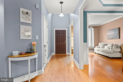 a view of a livingroom with furniture and wooden floor