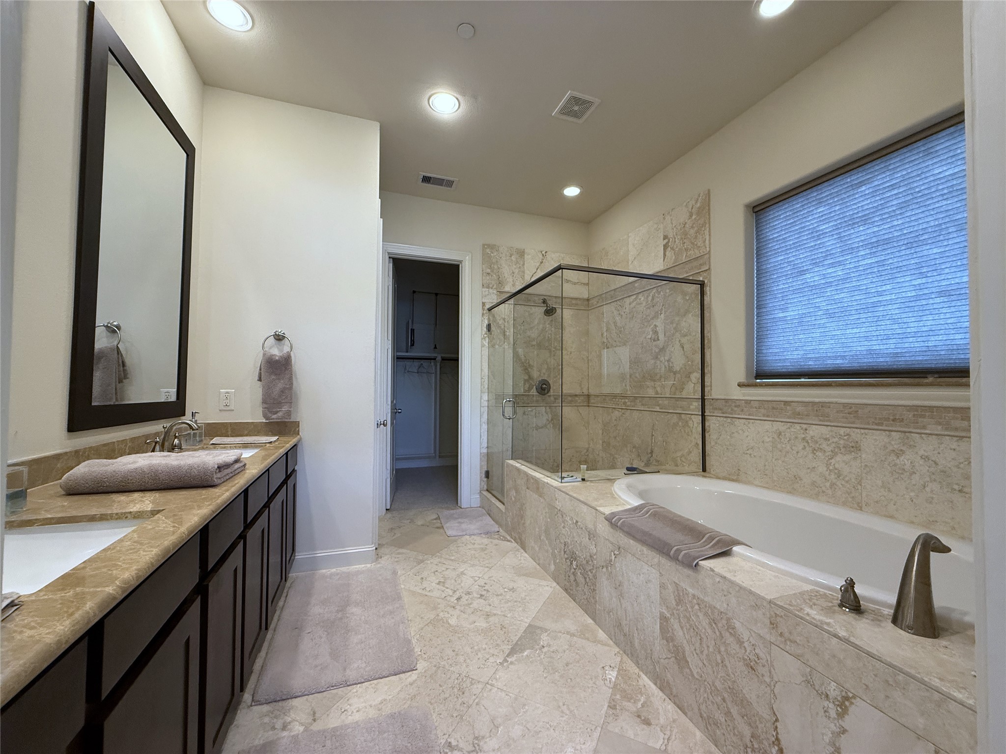 705 Delano Street Houston, TX 77003 - Photo 20 of 28 a bathroom with a granite countertop sink a toilet and shower