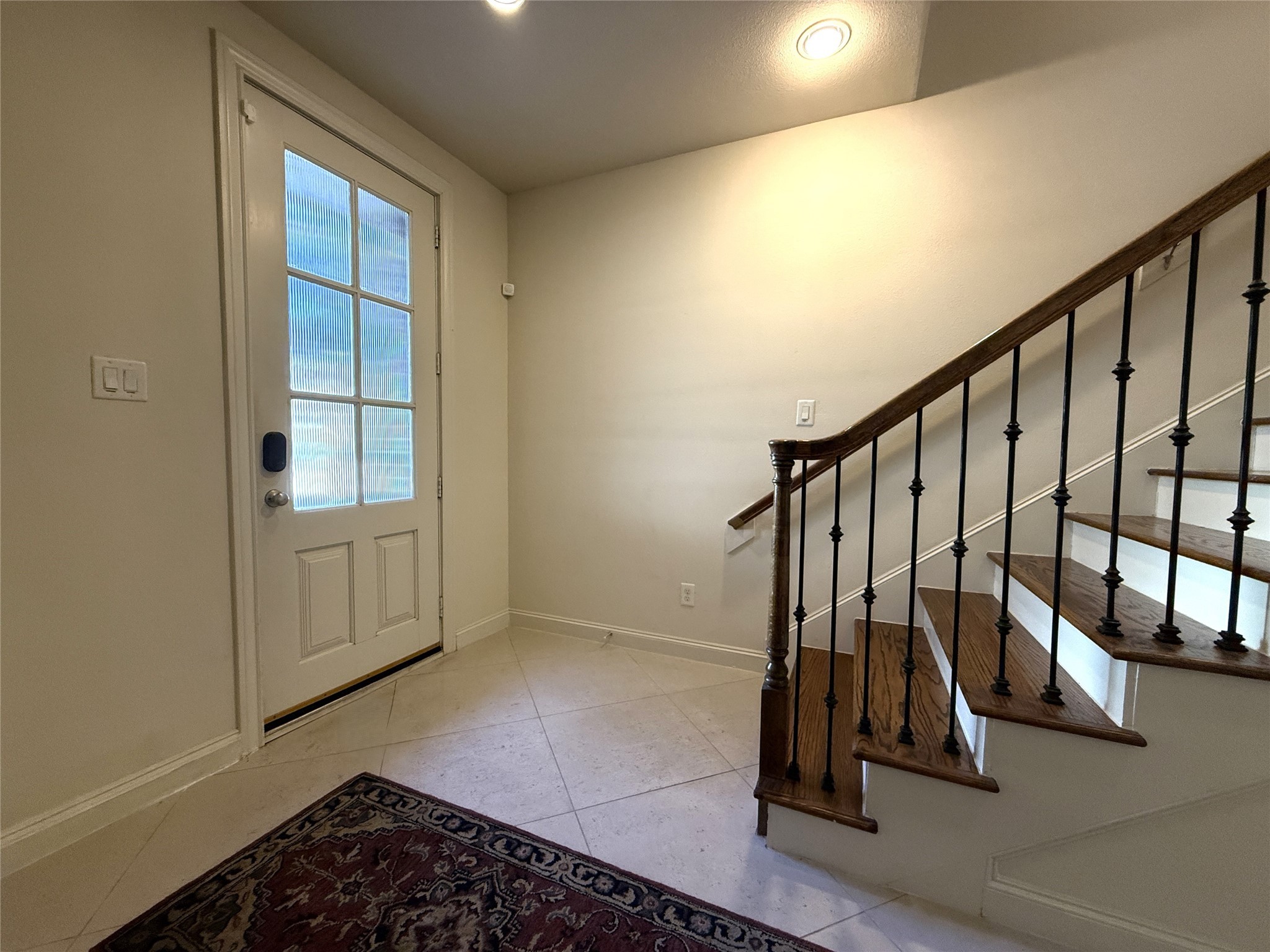 705 Delano Street Houston, TX 77003 - Photo 2 of 28 a view of entryway with wooden floor and stairs