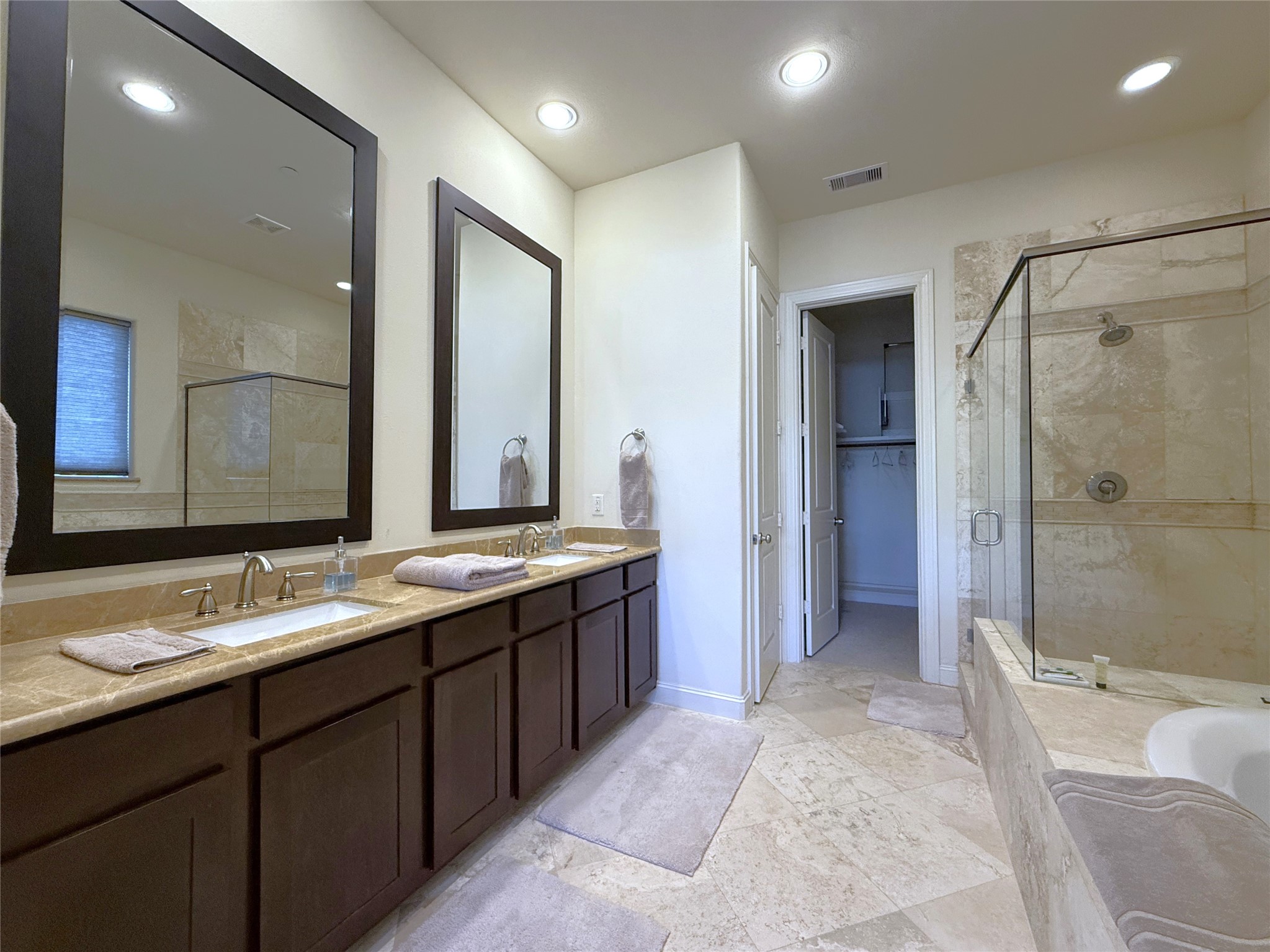 705 Delano Street Houston, TX 77003 - Photo 21 of 28 a spacious bathroom with a double vanity sink mirror double and shower