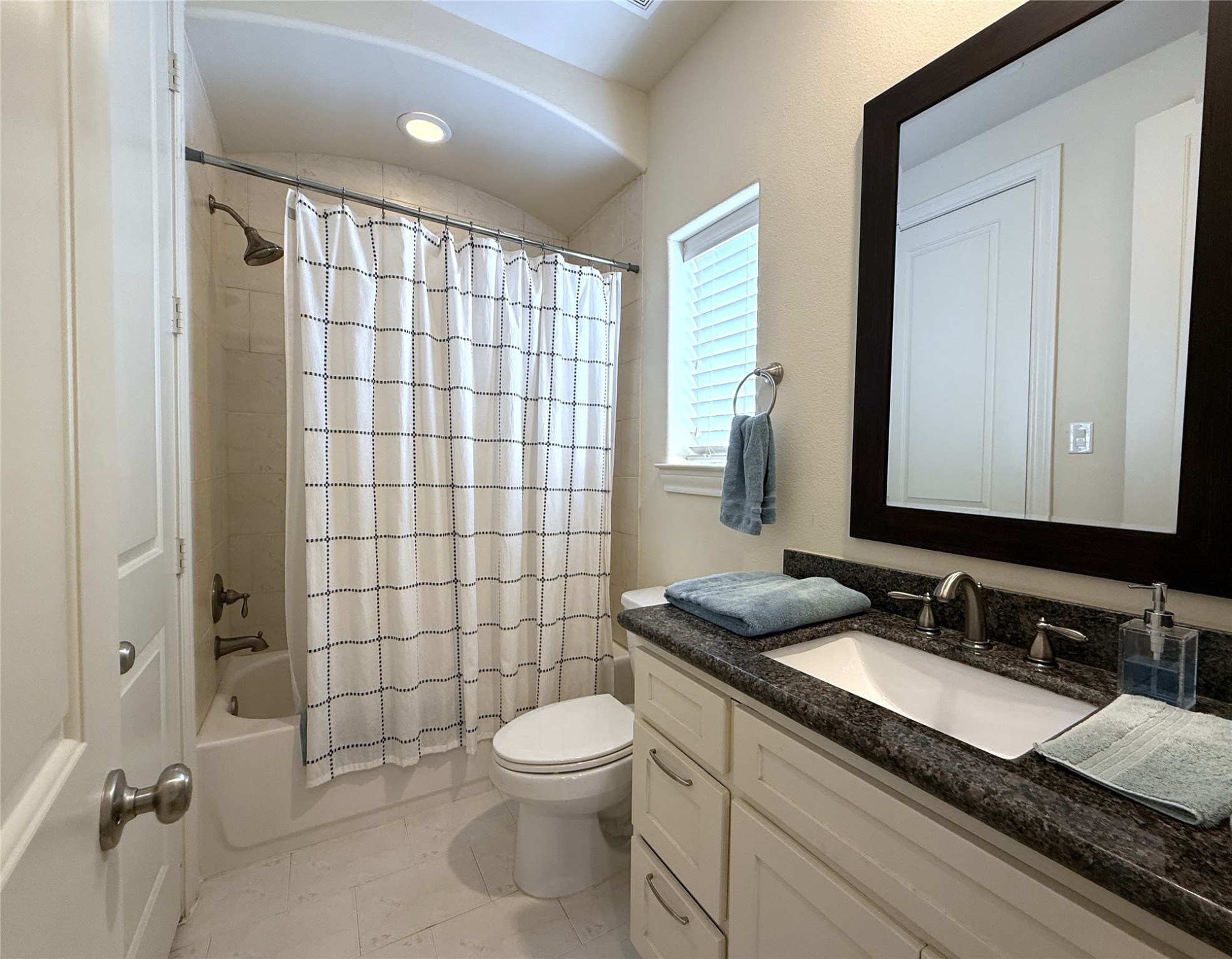 705 Delano Street Houston, TX 77003 - Photo 23 of 28 a bathroom with a granite countertop sink toilet and shower