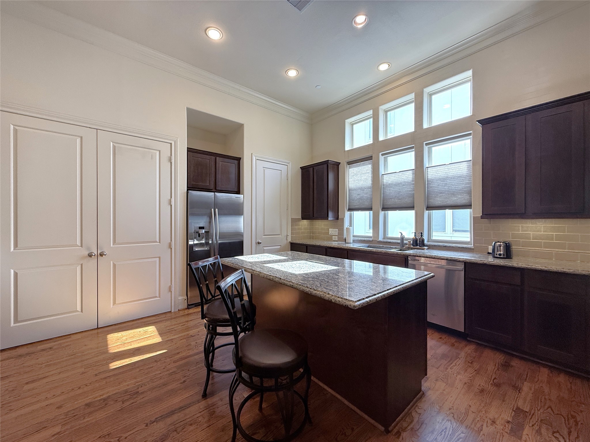 705 Delano Street Houston, TX 77003 - Photo 9 of 28 a kitchen with a table chairs sink and cabinets