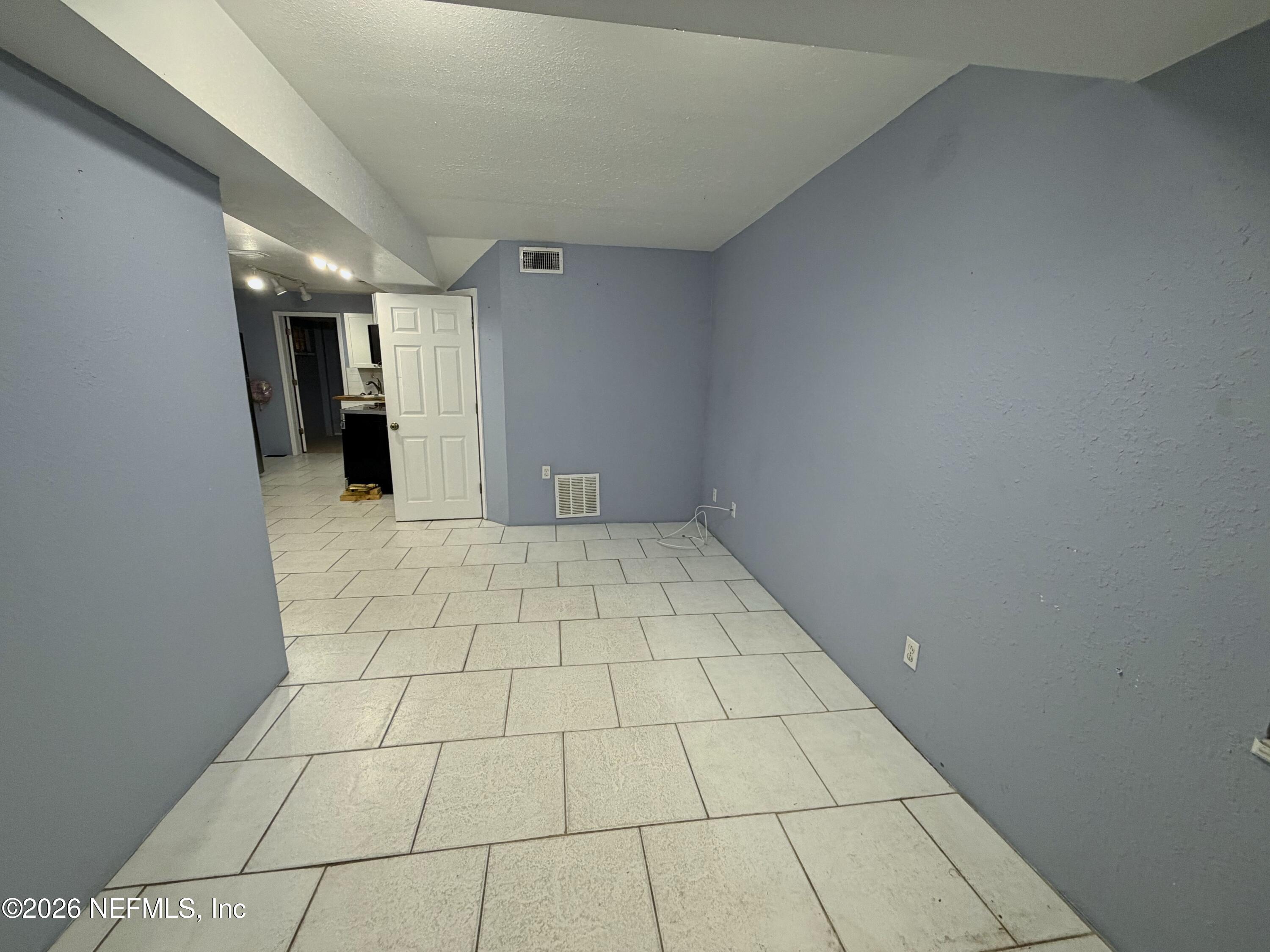 8 10th Street, Unit B St. Augustine, FL 32080 - Photo 2 of 14 a view of an empty room
