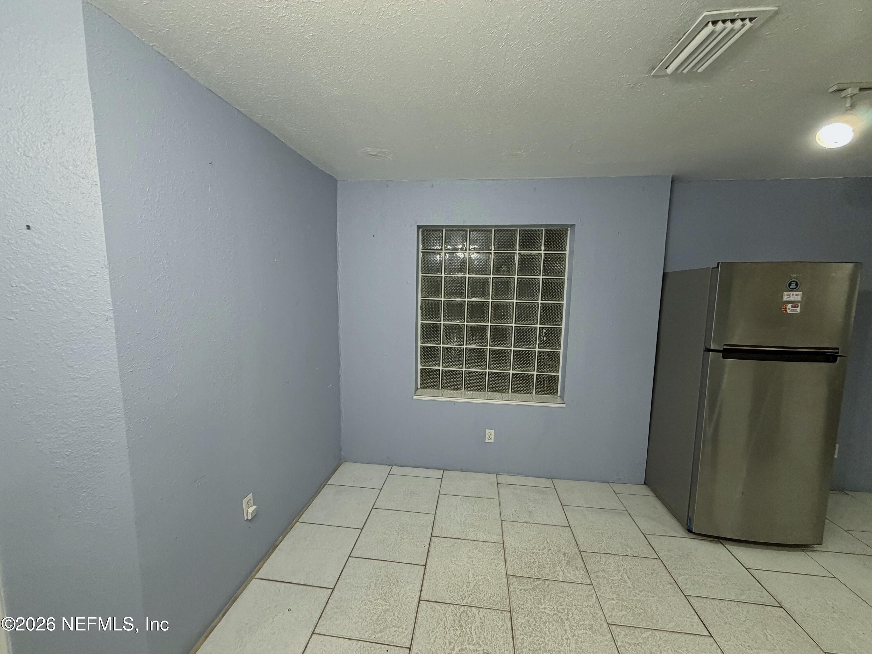 8 10th Street, Unit B St. Augustine, FL 32080 - Photo 4 of 14 a view of an empty room with a window