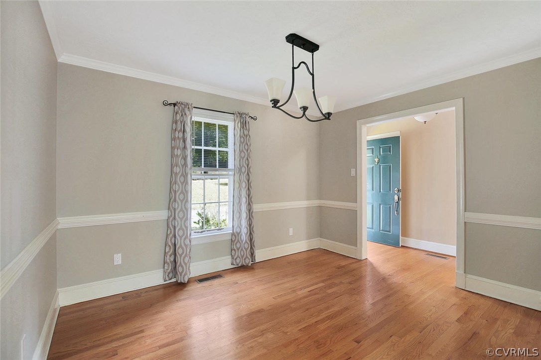 11452 Rolling Brook Road Chester, VA 23831 - Photo 11 of 23 a view of empty room with wooden floor and fan