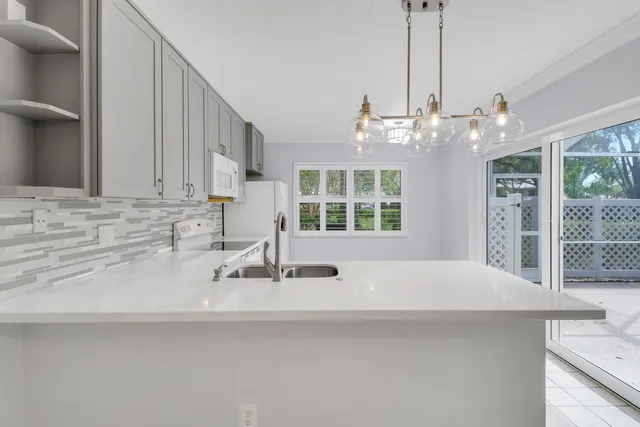a kitchen with a sink and a window