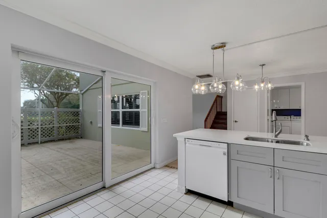 a view of a kitchen and entryway