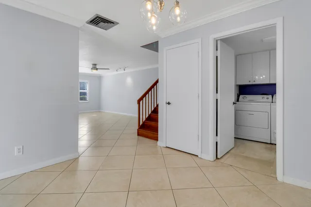 a view of a kitchen with a sink and dishwasher cabinets