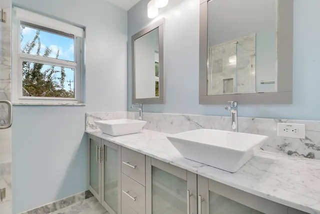 a bathroom with a sink and a mirror