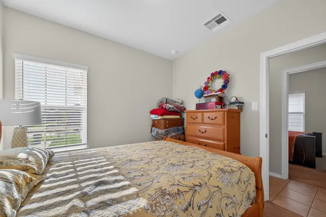 a bedroom with a bed and a closet