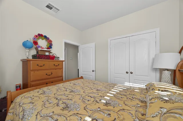 a bed room with a bed and a dresser