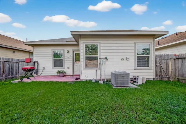 a front view of house with yard and outdoor seating