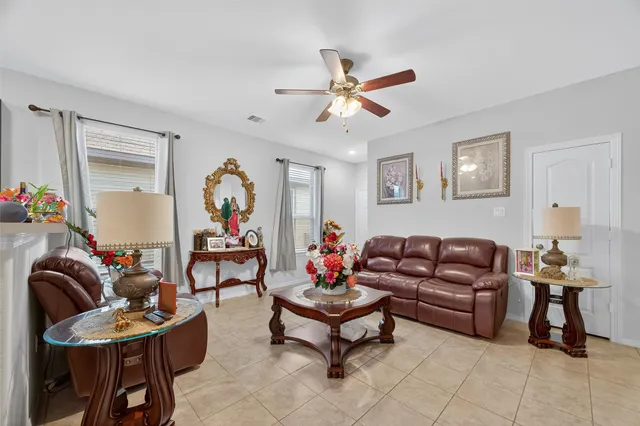 a living room with furniture and a window