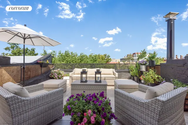 a view of a patio with couches and potted plants