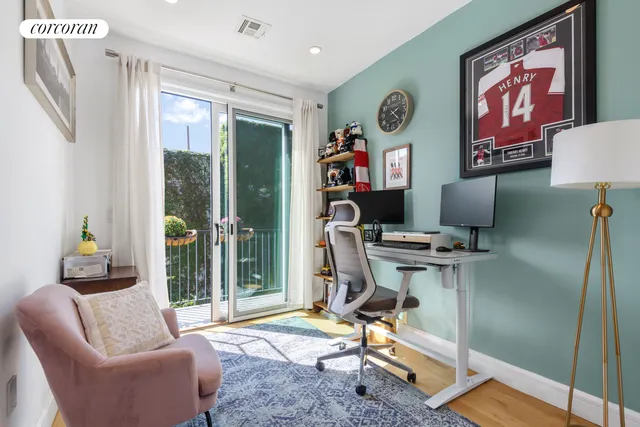 a work room with furniture and a window