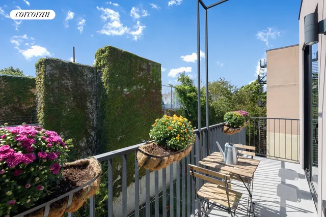 a balcony view with couple of chairs
