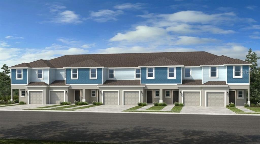 13134 Stable Place Parrish, FL 34219 - Photo 1 of 28 a front view of a residential apartment building with a yard