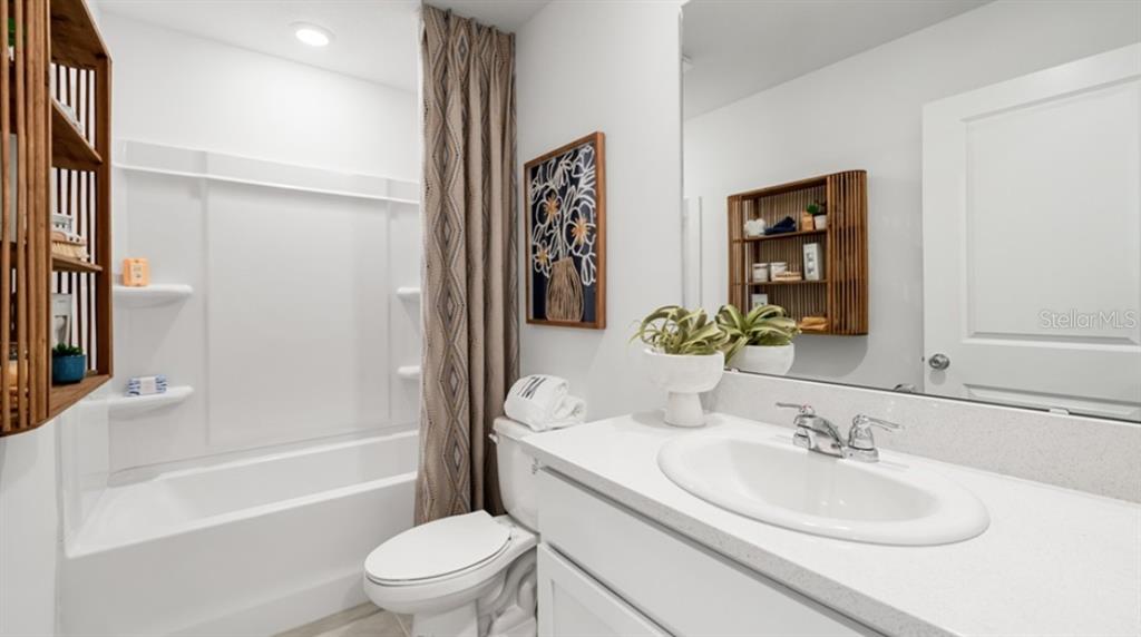13134 Stable Place Parrish, FL 34219 - Photo 15 of 28 a bathroom with a sink a toilet and shower