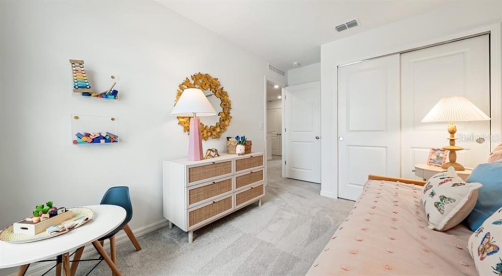 13134 Stable Place Parrish, FL 34219 - Photo 17 of 28 a bed room with a bed and a chair