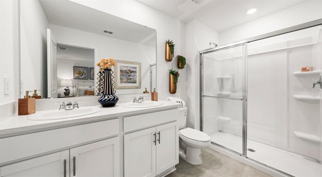13134 Stable Place Parrish, FL 34219 - Photo 8 of 28 a bathroom with a sink a toilet and shower