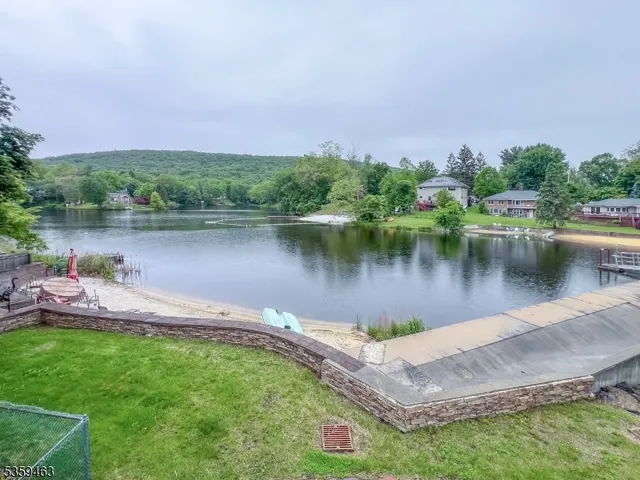 a view of a lake with a house in the background