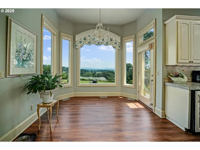 a view of an entryway with wooden floor