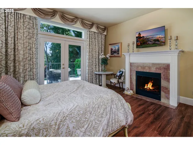 a bedroom with a bed and a fireplace