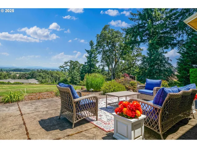 a outdoor living space with furniture and city view