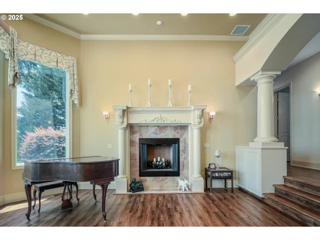a living room with a fireplace and a table