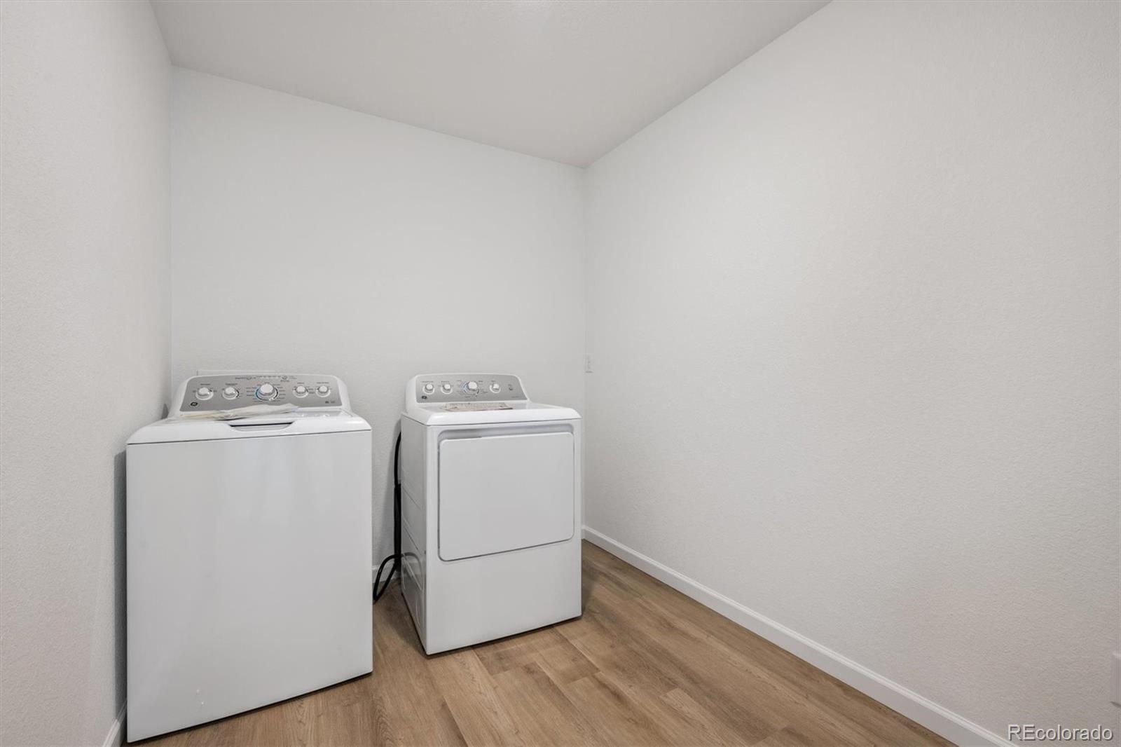 45929 Gentry Avenue Bennett, CO 80102 - Photo 13 of 24 a utility room with dryer and washer
