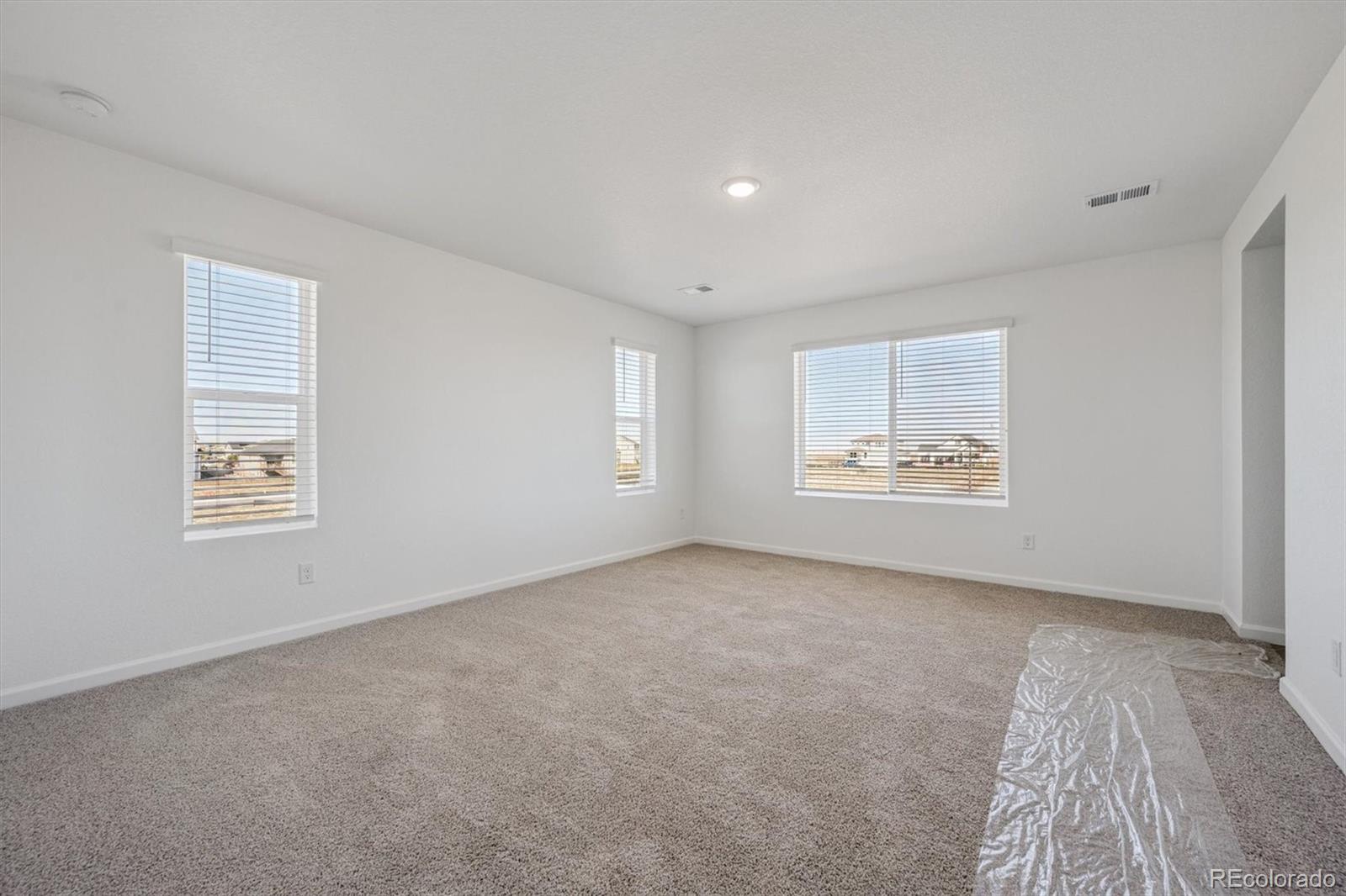 45929 Gentry Avenue Bennett, CO 80102 - Photo 14 of 24 an empty room with windows