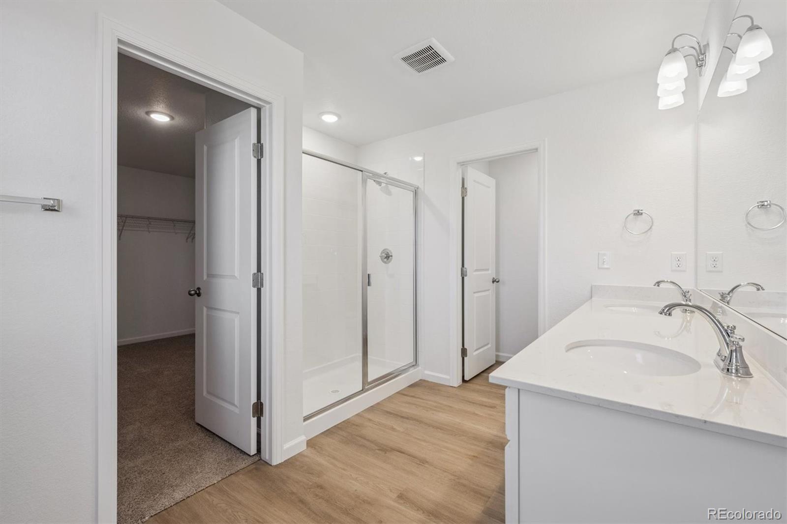 45929 Gentry Avenue Bennett, CO 80102 - Photo 16 of 24 a bathroom with a sink and a mirror