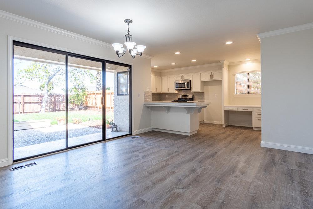1220 Heather Glen Circle Hollister, CA 95023 - Photo 11 of 41 a view of a kitchen with a stove wooden cabinets and wooden floor